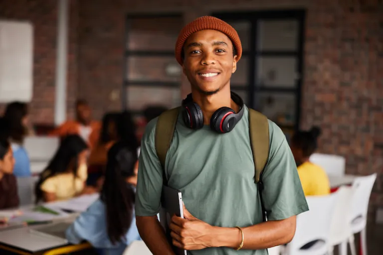 student holding notebook