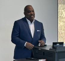 a man speaking at a podium