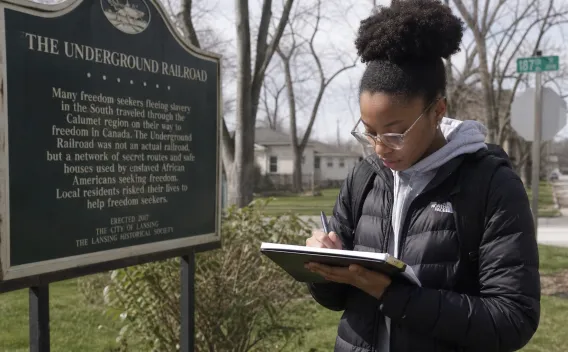 student studying history in the field